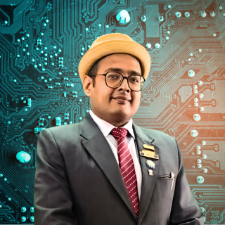 Amitt Jinddl, AI and Digital Business Coach, in a grey suit against a circuit-board background